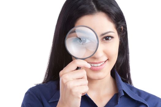 Happy young woman looking through magnifying glass isolated on white background.
