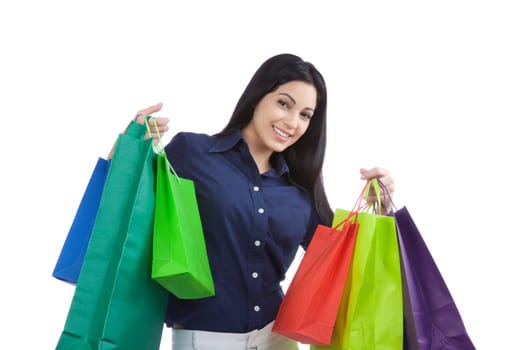 Close-up of happy young woman holding shopping bags isolated on white background.