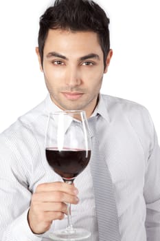 Happy young businessman holding red wine glass isolated on white background.