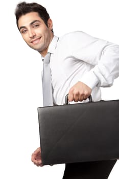 Young businessman  holding suitcase isolated on white background.