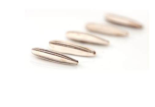 Extreme close-up image of sunflower seeds studio isolated on white background 