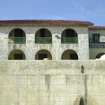 Old tropical villa made of stone blocks
