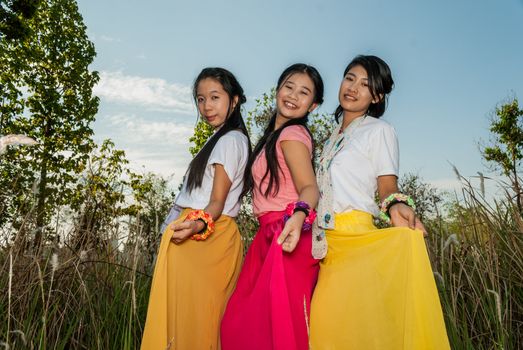 Asian Thai girls are picking their skirts.