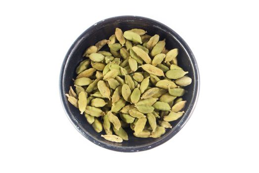 Pile of whole cardamom on white background