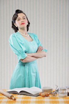 Vintage portrait of a housewife in the kitchen
