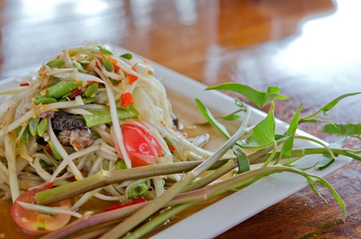 close up of spicy papaya salad  and fresh vegetable