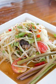 spicy papaya salad  and mix  vegetable on white dish