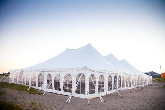 Party or event white tent during the evening