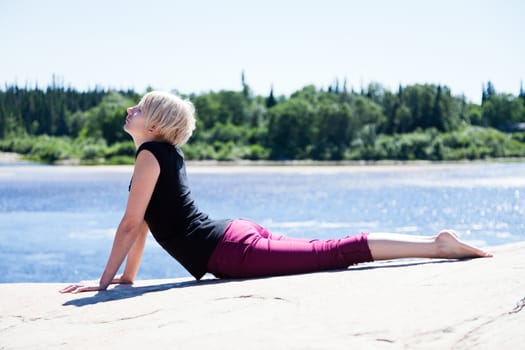 Yoga in nature with a young girl