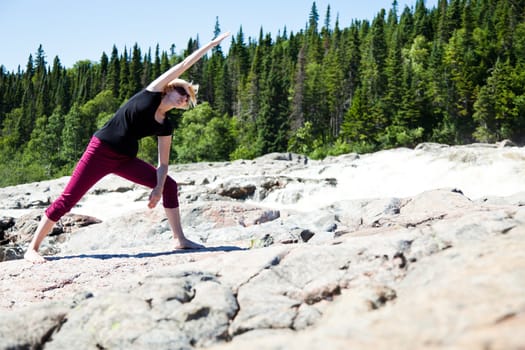 Yoga in nature with a young girl