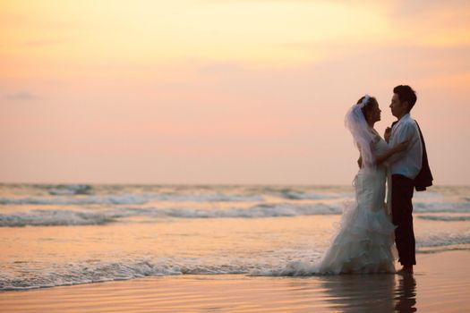 happiness and romantic Scene of love couples partners wedding on the Beach