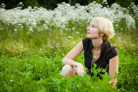 Girl in a field of flowers