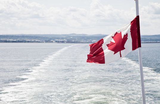 View of the sea and the flag of Canada