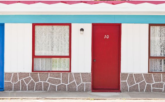 Motel with red and blue doors