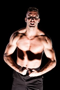 Muscular man isolated on black background