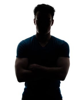 Male figure in silhouette looking at the camera isolated on white background