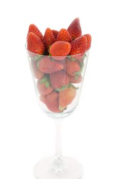 red fruits  ( fresh strawberry )  in glass  on white background