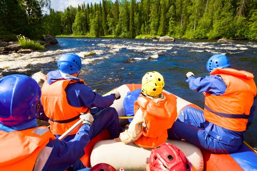 Rafters in a rafting boat on Pistojoki river in Karelia, Russia