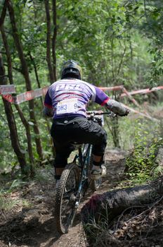 Hua Hin,Thailand - December 1st : Unidentified bicycle racing downhill competitors during the "Hua Hin mountain bike racing 2012  " at Hinlekfai mountain on December 1st, 2012 in Hua Hin,Thailand. 