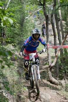 Hua Hin,Thailand - December 1st : Unidentified bicycle racing downhill competitors during the "Hua Hin mountain bike racing 2012  " at Hinlekfai mountain on December 1st, 2012 in Hua Hin,Thailand. 