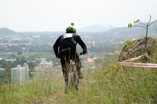 Hua Hin,Thailand - December 1st : Unidentified bicycle racing downhill competitors during the "Hua Hin mountain bike racing 2012  " at Hinlekfai mountain on December 1st, 2012 in Hua Hin,Thailand. 