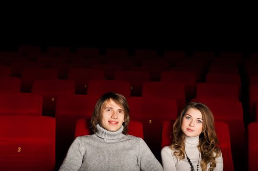 young couple in the cinema to enjoy the movie