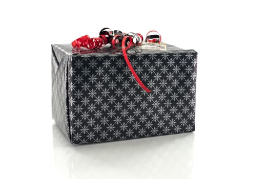 black present with red decoration on white background