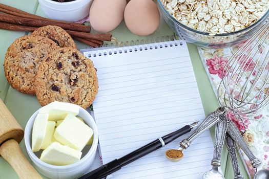 Fresh ingredients for oatmeal cookies with pen and paper. Shallow depth of field. 