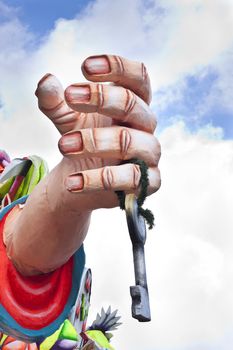 Close up of a carnival float in Malta, showing a hand with a symbolic key to heaven