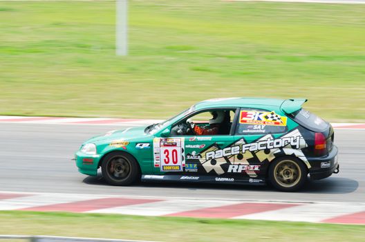 Nakhon Ratchasima, Thailand - March 9th:Unidentified car racing competitors during the "Thailand circuit 2013  " at Bonanza speedway on March 9th, 2013 in Nakhon Ratchasima, Thailand. 
