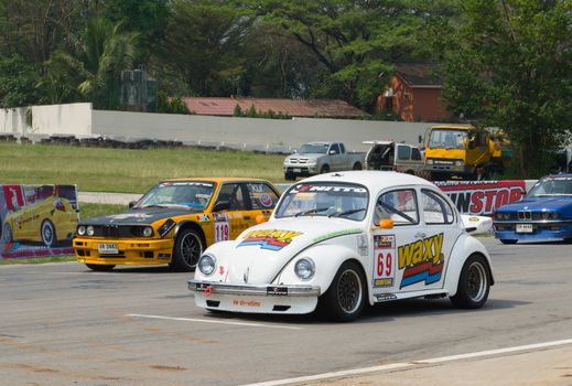 Nakhon Ratchasima, Thailand - March 9th:Unidentified car racing competitors during the "Thailand circuit 2013  " at Bonanza speedway on March 9th, 2013 in Nakhon Ratchasima, Thailand. 