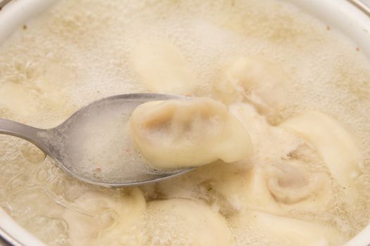 dumplings are boiled in a pot