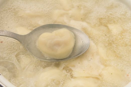dumplings are boiled in a pot