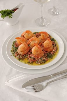 Grilled shrimp with tomatoes, garlic and herbs in a spicy gravy