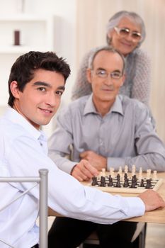 Grandfather and grandson playing chess