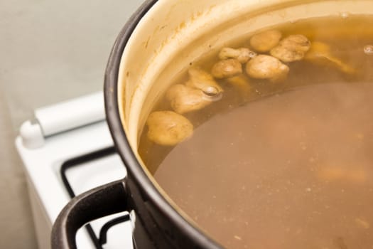 Mushrooms cook in a pan