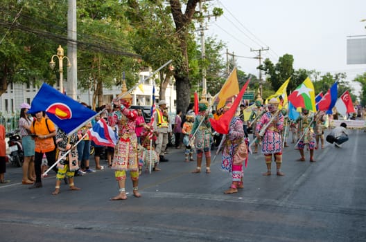 Phetchaburi, Thailand - March 28th:participants in Phranakhonkhiri festival parade 2013 on public street in front of Khao Wang  Phetchaburi on March 28th, 2013 in Phetchaburi Province, Thailand. 