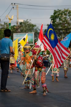 Phetchaburi, Thailand - March 28th:participants in Phranakhonkhiri festival parade 2013 on public street in front of Khao Wang  Phetchaburi on March 28th, 2013 in Phetchaburi Province, Thailand. 