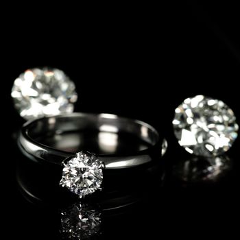 wedding diamond ring on black background