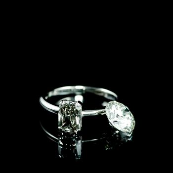 wedding diamond ring on black background