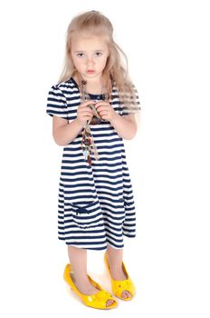 Shot of little cute with mother shoes in studio standing