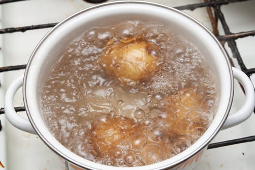 New potatoes simmering in boiling water 