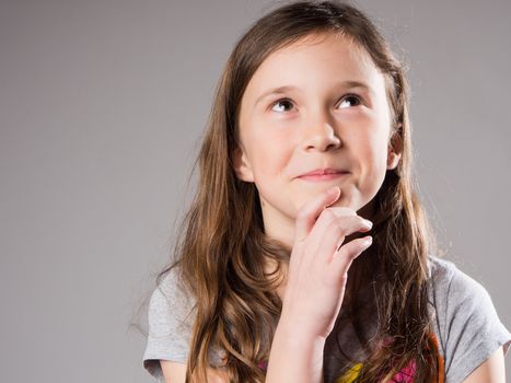 Mischievous little girl in studio