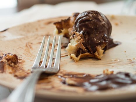 Half-eaten banana and chocolate pancake