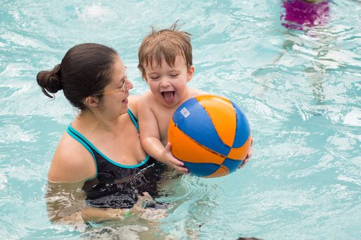 Family playing in the pool at Jay Peak's water park and resort