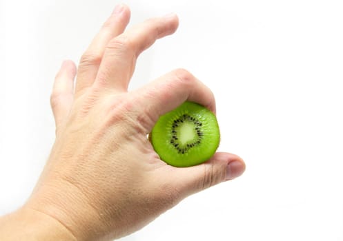 kiwi  in a hand on a white background