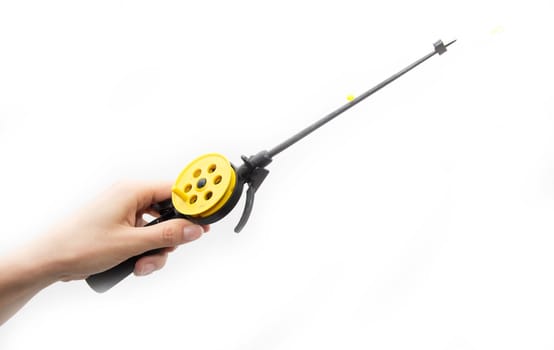 Fishing tackle in a hand on a white background