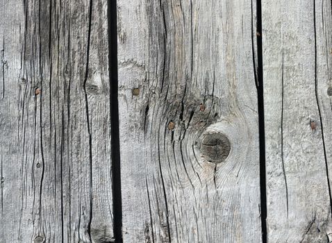 Close up of gray wooden fence panels 