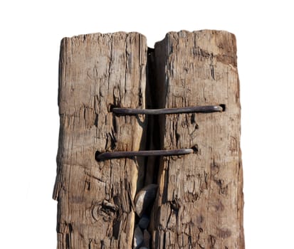 split sleeper connected by two rusty nails on a white background