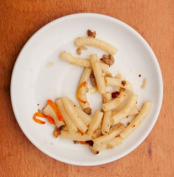 pasta in a bowl on a wooden background